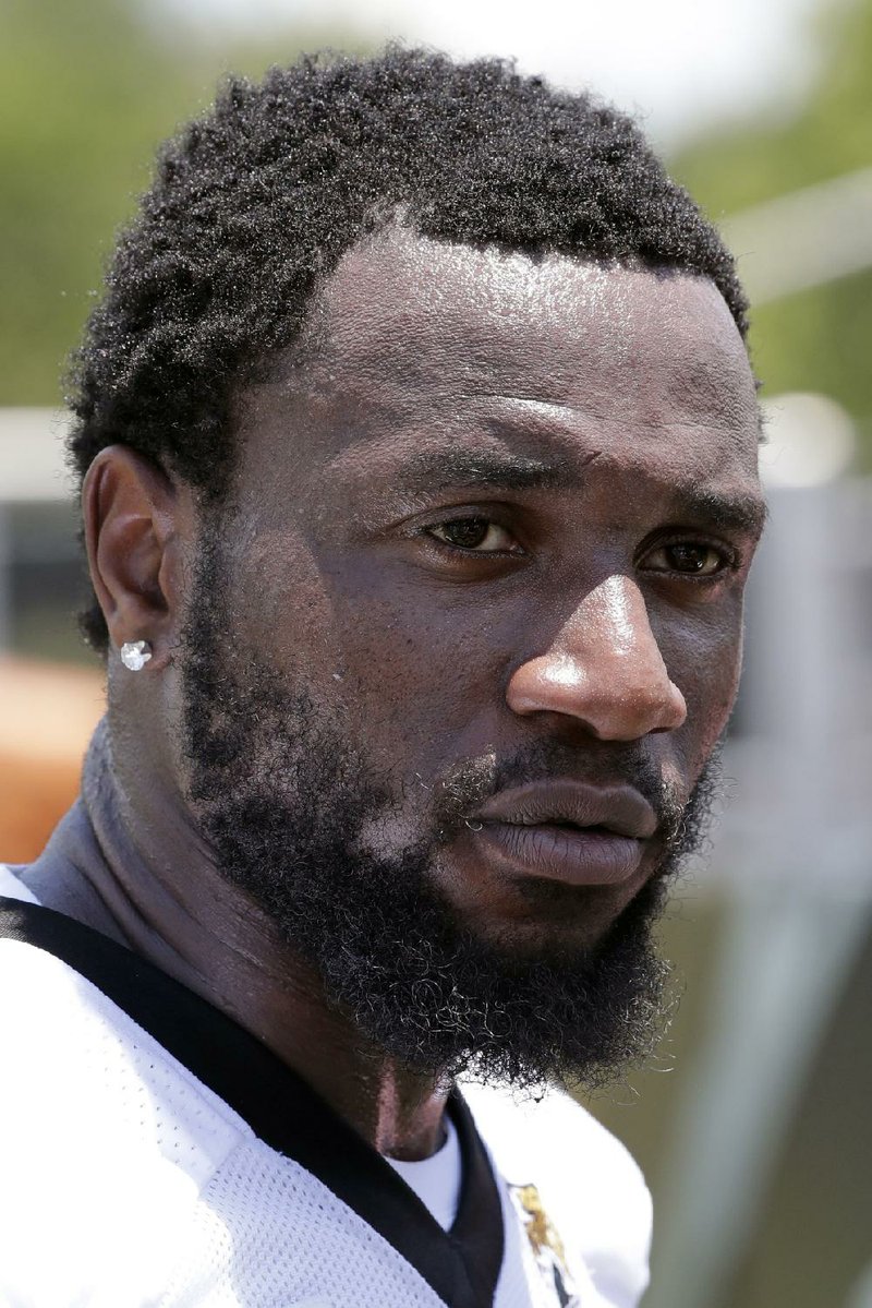 FILE - In this May 21, 2019, file photo, Jacksonville Jaguars defensive end Yannick Ngakoue talks with reporters after an NFL football practice in Jacksonville, Fla.  Standout defensive end Yannick Ngakoue no longer wants to sign a long-term deal with the Jacksonville Jaguars. Ngakoue announced his desire to play elsewhere via social media Monday, March 2, 2020, a move that could force the team to place the franchise tag on the 24-year-old disgruntled defender and trade him.(AP Photo/John Raoux, File)