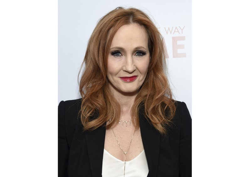FILE - This Dec. 11, 2019 file photo shows J.K. Rowling, author of the &quot;Harry Potter&quot; book series, at the premiere of &quot;Finding the Way Home&quot; in New York. The author has launched an online initiative, www.harrypotterathome.com, which features quizzes, games and other activities. For the month of April, Rowling also has partnered with the audio publisher-distributor Audible and the library e-book supplier OverDrive for free audio and digital editions of the first Potter book, &#x201c;Harry Potter and the Philosopher's Stone.&#x201d; The U.S. edition is called &#x201c;Harry Potter's and the Sorcerer's Stone&#x201d;. (Photo by Evan Agostini/Invision/AP, File)
