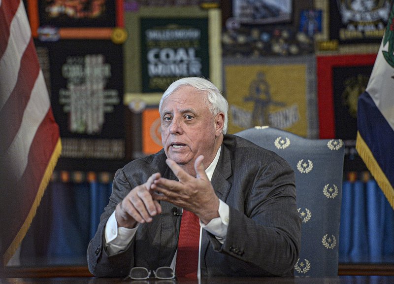 West Virginia Gov. Jim Justice holds a news conference last month at the state Capitol in Charleston. Justice’s coal companies have agreed to pay millions for mine safety violations.
(Charleston Gazette-Mail/F. Brian Ferguson)
