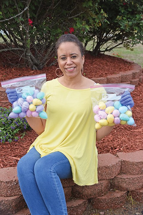 Aisha Credit, the new event public-relations coordinator for the Jacksonville Parks and Recreation Department, displays the bags of plastic eggs that will be given out during Friday’s drive-thru Easter egg hunt, beginning at 11 a.m. at the Martin Street Youth Center.