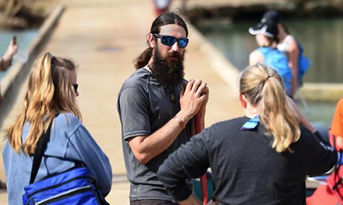Aaron Jones (center) of Lost Valley Canoe and Lodging instructs Buffalo River boaters Sunday at the Ponca access.
(NWA Democrat-Gazette/David Gottschalk)