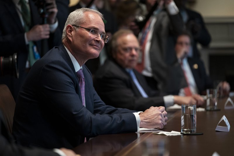 Exxon Mobil CEO Darren Woods listens as President Donald Trump speaks during a meeting with energy sector business leaders in the Cabinet Room of the White House on Friday in Washington. - AP Photo/Evan Vucci