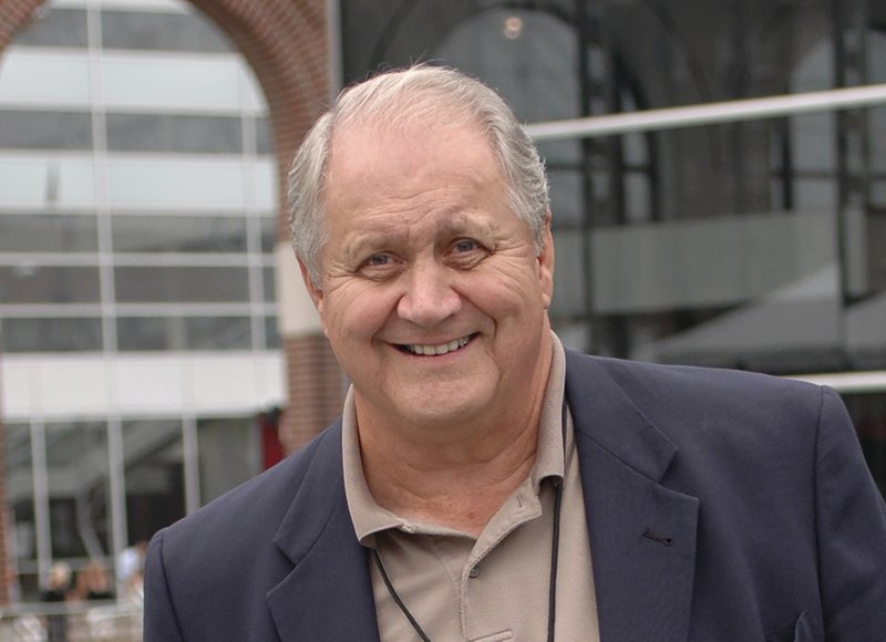 Jim Houston smiles as he walks through an Aug. 10, 2006, reception for players being enshrined into the College Football Hall of Fame, in South Bend, Ind. Houston's widow would keep notes on her husband's deteriorating condition in a three-ring binder so she would be prepared for the day when he needed full-time care. - Photo by Joe Raymond of The Associated Press 