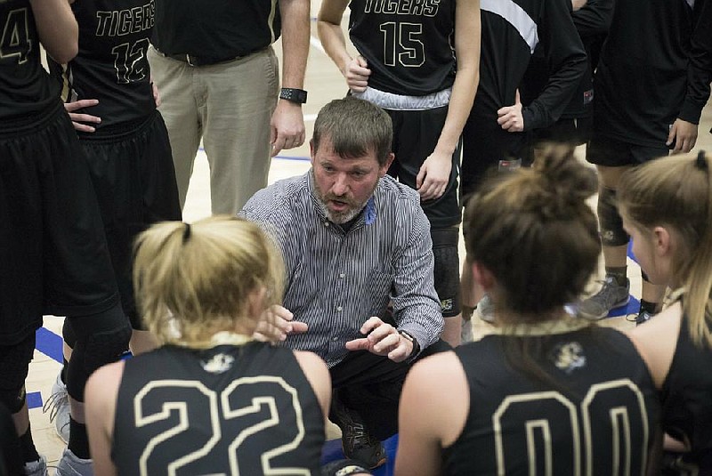 NWA Democrat-Gazette/CHARLIE KAIJO Bentonville High School head coach Tom Halbmaier talks to his team during a basketball game, Friday, February 15, 2019 at King Arena at Rogers High School in Rogers. 

