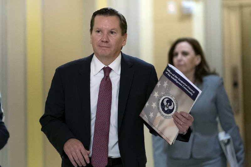 Michael Atkinson arrives Oct. 4 at the Capitol for private questioning by impeachment investigators. On Friday, President Donald Trump fired him, telling Senate Intelligence Committee members in a letter that he no longer had confidence in Atkinson as inspector general.
(AP/J. Scott Applewhite)