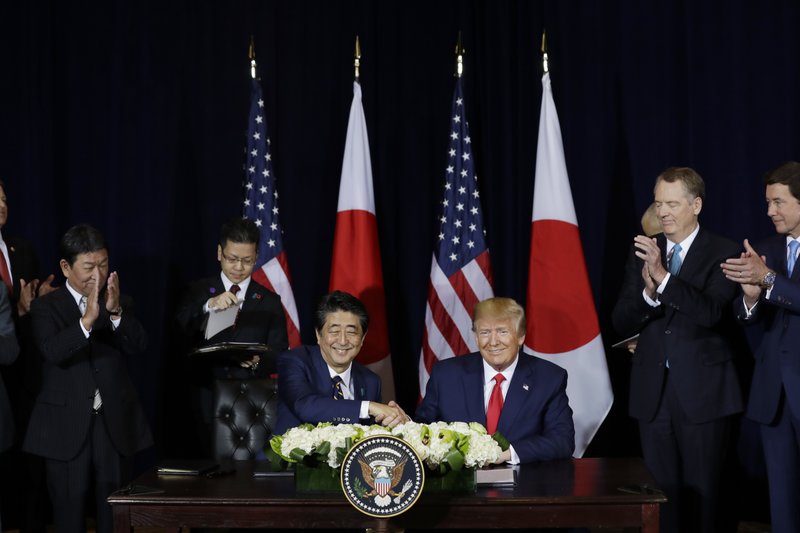 FILE - In this Sept. 25, 2019 file photo, President Donald Trump meets with Japanese Prime Minister Shinzo Abe at the InterContinental Barclay New York hotel during the United Nations General Assembly in New York. With entire countries on lockdown, state visits canceled, travel curtailed and key meetings postponed or moved online, the coronavirus pandemic has dramatically altered international diplomacy. (AP Photo/Evan Vucci)