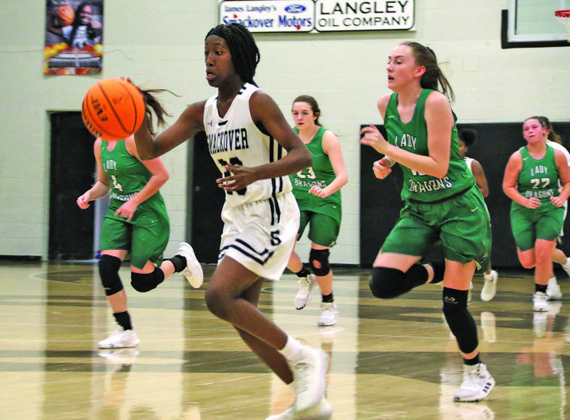 Smackover's Adrianna Grant pushes the ball up the court against Genoa Central. Grant is a finalist for News-Times/Sports Alley Girls Basketball Player of the Year.