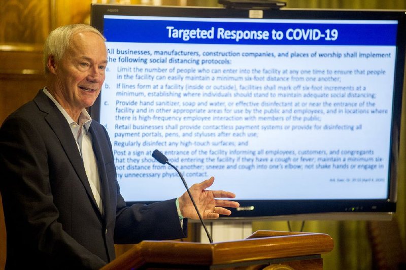 Gov. Asa Hutchinson said Saturday that the day’s number of cases indicated the “slow growth” of the coronavirus in Arkansas. Also Saturday, Hutchinson ordered lodging providers not to accept recreational travelers from out of state as a targeted measure against the virus.
(Arkansas Democrat-Gazette/Stephen Swofford)