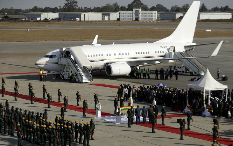 A coffin carrying the body of Zimbabwe’s former ruler Robert Mugabe arrives in Harare last year after a flight from Singapore. Mugabe often sought treatment in Asia instead of relying on his country’s health system.
(AP/Themba Hadebe)