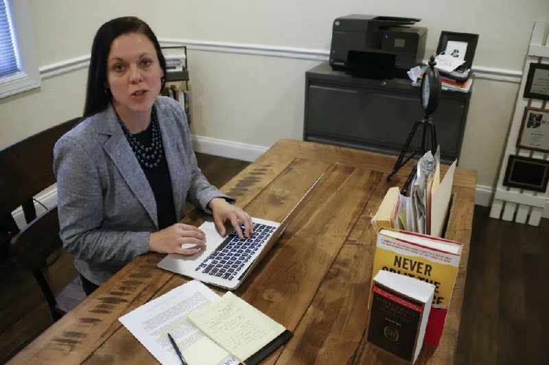 Nurse anesthetist Jess Poole checks for updates on the coronavirus pandemic from her home office in Greensburg, Pa. Poole worked for a private anesthesia practice in the Pittsburgh area until she was laid off a couple of weeks ago.
(AP/Keith Srakocic)