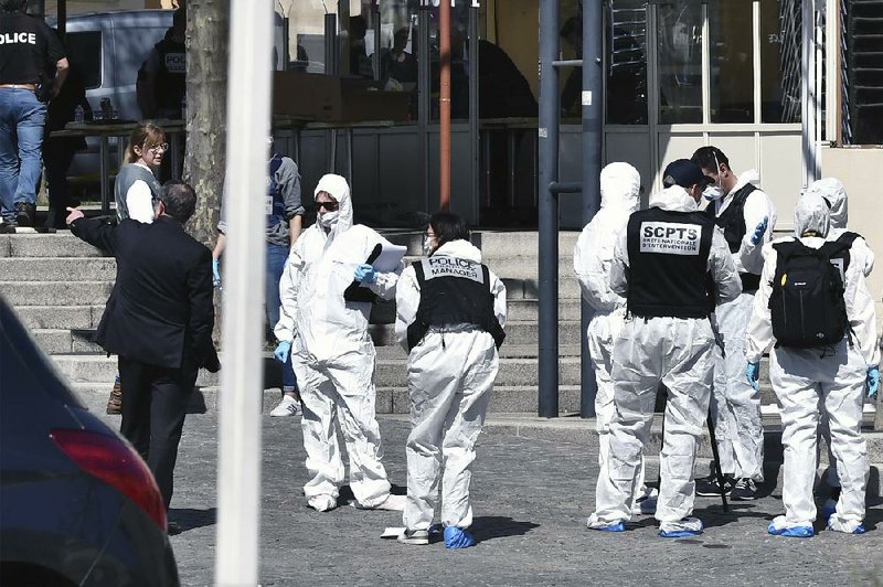 Police investigate Saturday’s knife attack in Romans-sur-Isere, France.
(AP)