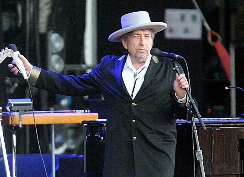 FILE - This July 22, 2012 file photo shows U.S. singer-songwriter Bob Dylan performing on at "Les Vieilles Charrues" Festival in Carhaix, western France. Dylanís ìLike a Rolling Stoneî is a getting its first official music video, nearly 50 years after the song was released. The interactive video will premiere on Dylanís website Tuesday, Nov. 19, 2013, and marks the release of the new 47-disc box set, ìThe Complete Album Collection Volume 1.î (AP Photo/David Vincent, file)