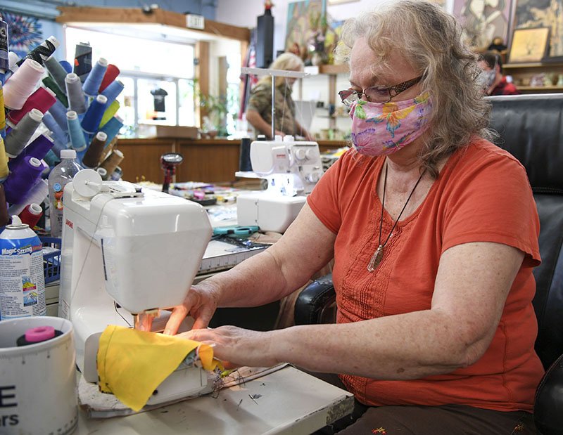 Hannah Mills, owner of Hot Springy Dingy sews a facemask on Monday. - Photo by Grace Brown of The Sentinel-Record