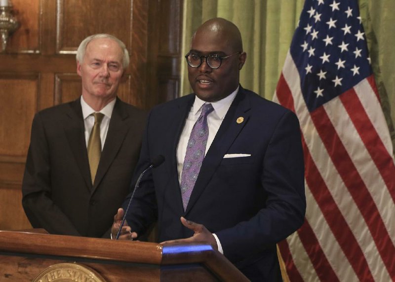 Little Rock Mayor Frank Scott Jr., right, along with Gov. Asa Hutchinson speaks Tuesday April 7, 2020 in Little Rock during the governor's daily press conference about the corona virus in Arkansas. 