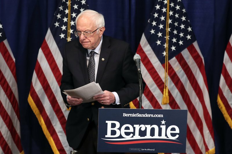 FILE -- Democratic presidential candidate, Sen. Bernie Sanders, I-Vt., walks from the podium after speaking to reporters on Wednesday, March 11, 2020, in Burlington, Vt. (AP Photo/Charles Krupa)
