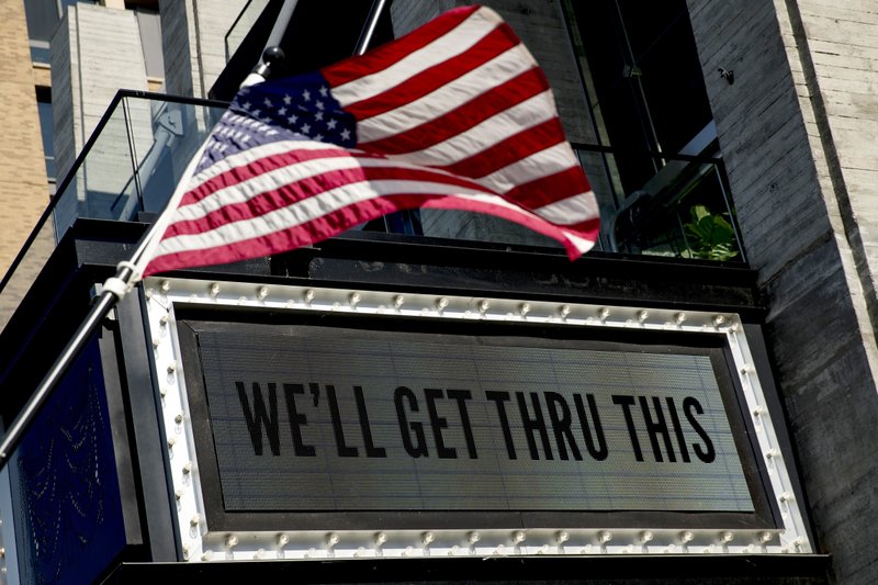 The Associated Press THE ANTHEM: In this April 6 photo, a sign at The Anthem music venue reads "We'll Get Thru This" at the wharf which is almost completely empty because of the coronavirus outbreak in Washington. The coronavirus pandemic has gut-punched global markets, put 6.6 million Americans out of work and raised the strong likelihood of a recession. But in the Washington lobbying world, business is booming.