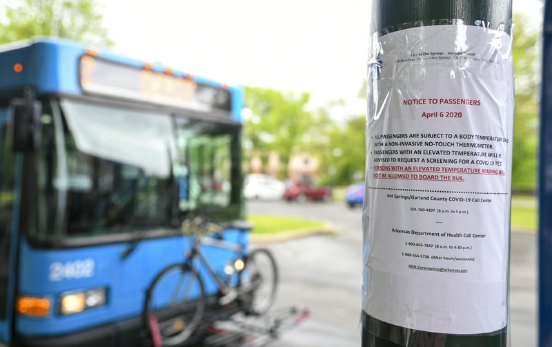 A sign posted at Transportation Depot Tuesday advises bus riders of new Intracity Transit policies in response to COVID-19. Riders will be screened for fevers and denied passage if they have elevated temperatures. - Photo by Grace Brown of The Sentinel-Record