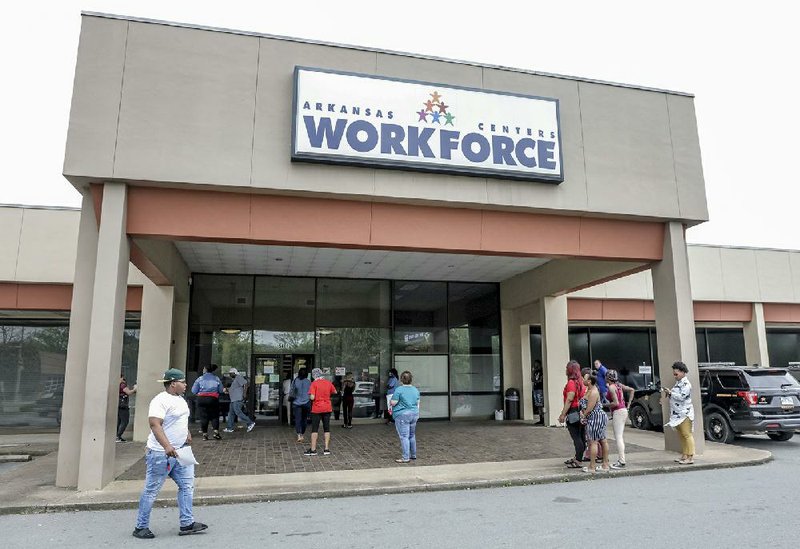 FILE — People enter and leave the entrance to the Arkansas Workforce Center, located at 5401 South University Avenue in Little Rock in this April 8, 2020 file photo.  
(Arkansas Democrat-Gazette/John Sykes Jr.)