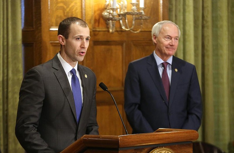 Arkansas Economic Development Commission Executive Director Mike Preston (left) talks about unemployment numbers as Gov. Asa Hutchinson looks on during a press briefing on Wednesday, April 8, 2020, at the state Capitol in Little Rock. 
(Arkansas Democrat-Gazette/Thomas Metthe)