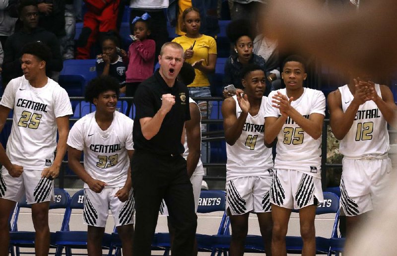 Little Rock Central Coach Brian Ross exhorts his players during the Tigers’ victory over Fort Smith Northside on March 7 in the Class 6A semifinals. The Arkansas Activities Association elected to cancel the Class 6A boys final and seven other champion- ship games because of the coronavirus pandemic, declaring co-champions in four classifications. 
(Arkansas Democrat-Gazette/Thomas Metthe) 