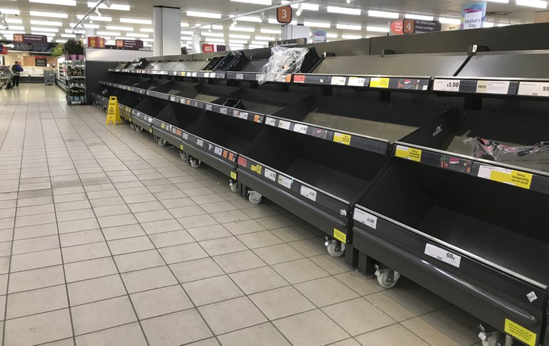 This March 19, 2020 file photo shows empty shelves in a supermarket in London, amid panic-buying due to the coronavirus outbreak. A pandemic forcing everyone to stay home could be the perfect moment for online grocery services. In practice, they've been struggling to keep up with a surge in orders, highlighting their limited ability to respond to an unprecedented onslaught of demand. After panic buying left store shelves stripped of staples like pasta, canned goods and toilet paper, many shoppers quickly found online grocery delivery slots almost impossible to come by, too. - AP Photo/Kirsty Wigglesworth
