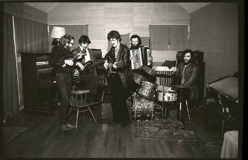 “The story of The Band was unique and so beautiful, and it went up in flames,” Robbie Robertson (third from left with the guitar) says in the new documentary, Once Were Brothers. The other members of the group, shown in this circa 1969 photo are (from left), Levon Helm on mandolin, Rick Danko on bass, Garth Hudson on accordion and Richard Manuel on drums.