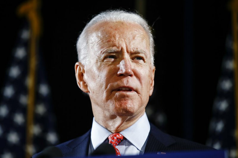 In this March 12, 2020, file photo, Democratic presidential candidate former Vice President Joe Biden speaks in Wilmington, Del. Biden expects to name a vice presidential vetting committee next week. That's according to three Democrats with knowledge of the situation who spoke to The Associated Press on condition of anonymity to discuss internal plans. (AP Photo/Matt Rourke)