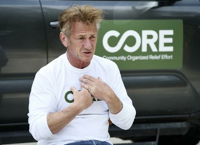 Actor Sean Penn, founder of the nonprofit organization Community Organized Relief Effort, is interviewed at his home, Wednesday, April 8, 2020, in Malibu, Calif. (AP Photo/Chris Pizzello)