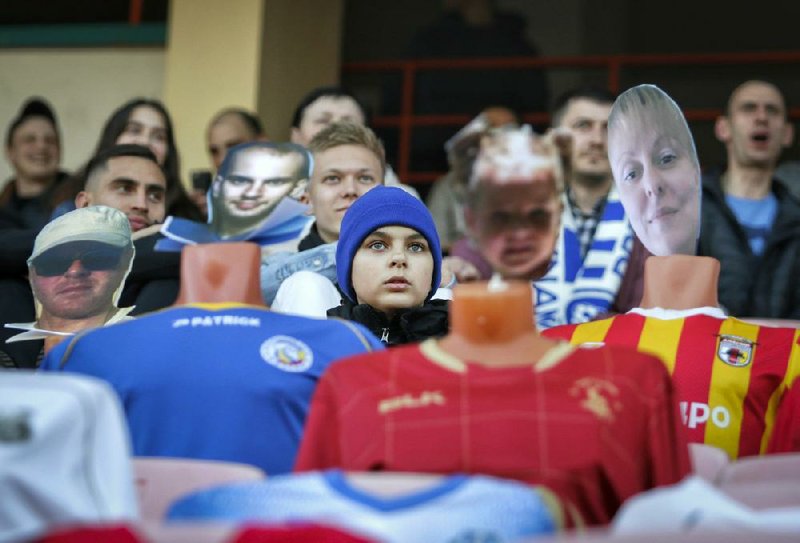 During Wednesday’s match between FC Dynamo Brest and FC Shakhter Soligorsk in Brest, Belarus, fans sit in the stands among mannequins in soccer uniforms with the faces of “virtual fans” who bought tickets online.
(AP/FC Dynamo Brest/Alexey Komelkov)