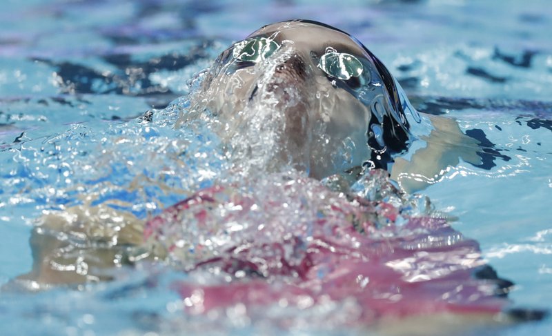 FILE - In this July 28, 2019 file photo, United States' Regan Smith swims the backstroke leg in the women's 4x100m medley relay final at the World Swimming Championships in Gwangju, South Korea. On Monday, March 30, 2020, the Tokyo Games were pushed back a full year by the coronavirus pandemic, to the same period of the biannual aquatics, causing the swimming's governing body to go back to the drawing board to figure out when to hold its next world championships. (AP Photo/Lee Jin-man, file)