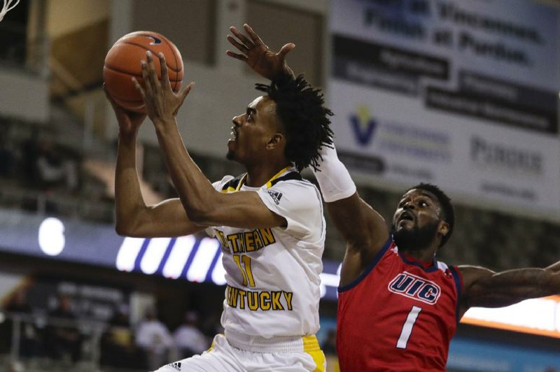 Northern Kentucky guard Jalen Tate (left) will transfer to Arkansas and be eligible for the 2020-2021 season as a graduate transfer. Tate averaged 13.9 points, 5.4 rebounds and 3.6 assists per game for the Norse, which won the Horizon League Tournament championship the past two seasons.
(AP/Michael Conroy)
