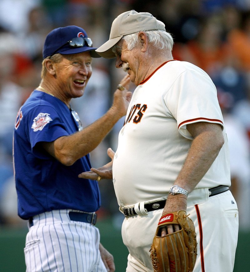 FILE - In this March 25, 2007 file photo, former Chicago Cubs great Glenn Beckert, left, exchanges greetings with Hall of Fame pitcher Gaylord Perry as the pair participate in the Legends of Baseball game at Bright House Networks Field in Clearwater, Fla. Beckert, a four-time All-Star second baseman for the Chicago Cubs in the 1960s and '70s, died in Florida Sunday, April 12, 2020, of natural causes. He was 79. (Joseph Garnett/Tampa Bay Times via AP, File)