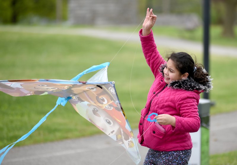 Crystal Mejia attempts to launch her kite Monday at Murphy Park in Springdale. The National Weather Service forecasts a chance of rain and snow before 11 a.m., then a chance of rain between 11 a.m. and 2 p.m. with a high near 48. Go to nwaonline.com/200414Daily/ and nwadg.com/photos for a photo gallery. (NWA Democrat-Gazette/David Gottschalk)