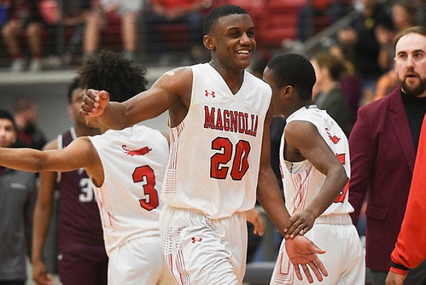 Magnolia guard Derrian Ford (20) reacts, Friday, March 6, 2020 during a basketball game at Cardinal Arena at Farmington High School in Farmington.