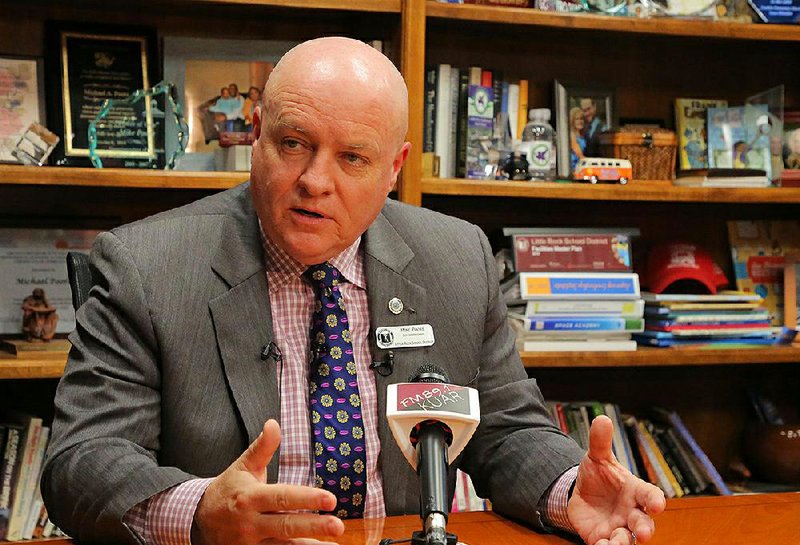 In this file photo Little Rock School District Superintendent Mike Poore talks to reporters at his office in Little Rock.