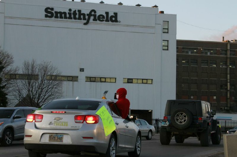Employees and their relatives protest outside the Smithfield Foods processing plant in Sioux Falls, S.D., on Thursday. The demonstrators complained of unsafe working conditions amid the coronavirus outbreak.
(AP/Stephen Groves)