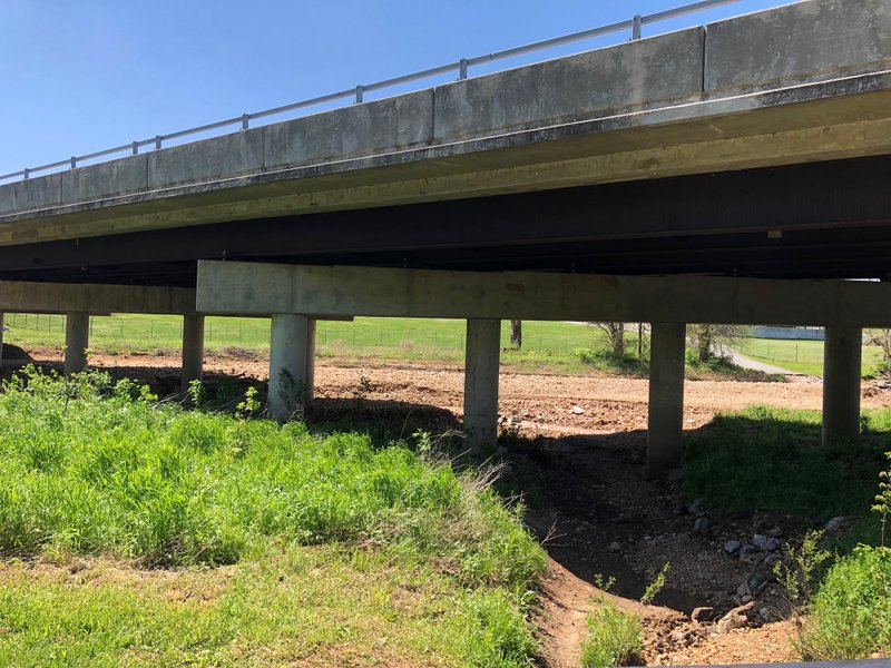 A body was found Wednesday morning under the bridge where Silent Grove Road crosses over the Lake Springdale Trail. (NWA Democrat-Gazette/LAURINDA JOENKS)