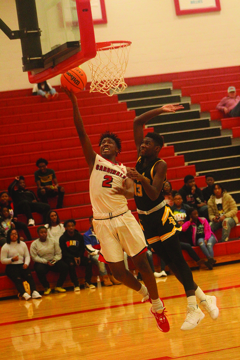 Strahan (2) goes up for a layup during a basketball game. story.lead_photo.caption