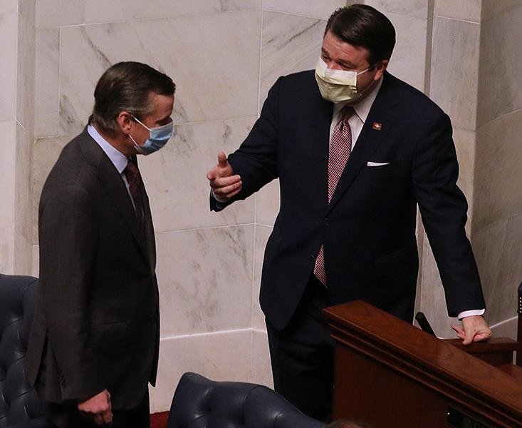 Sen. Scott Flippo (left), R-Bull Shoals, talks with Sen. Jason Rapert, R-Conway, before the state Senate session Wednesday at the state Capitol in Little Rock. More photos at www.arkansasonline.com/416ledge/.
(Arkansas Democrat-Gazette/Thomas Metthe)
