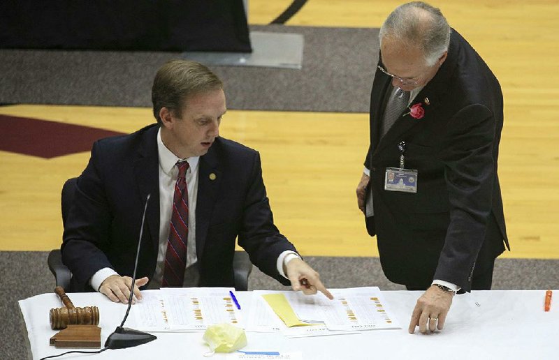 House Speaker Matthew Shepherd (left) and House Parliamentarian Buddy Johnson check the votes on a bill Thursday at the Jack Stephens Center in Little Rock as House and Senate lawmakers completed action on the budget for the coming fiscal year as they wrapped up their fiscal session. More photos at arkansasonline.com/417house/.
(Arkansas Democrat-Gazette/Staton Breidenthal)