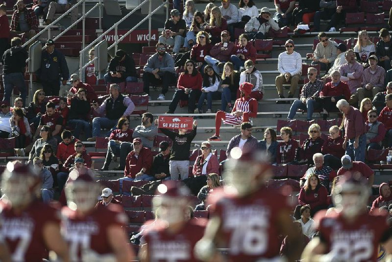 Fans look on during a 2019 Razorbacks game against Western Kentucky at Reynolds Razorback Stadium in Fayetteville. Arkansas Athletic Director Hunter Yurachek questioned how safe it would be for players to be on the field if it isn’t deemed safe for fans to be in the stands.
(NWA Democrat-Gazette/Charlie Kaijo)
