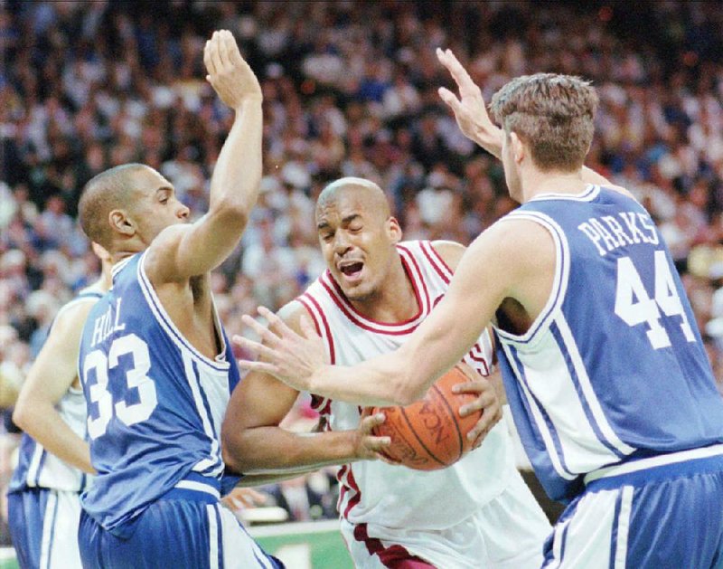 Duke’s Grant Hill (33) and Cherokee Parks try to contain Arkansas’ Corliss Williamson during the first half. Williamson finished with 23 points and eight rebounds.
(AP file photo)