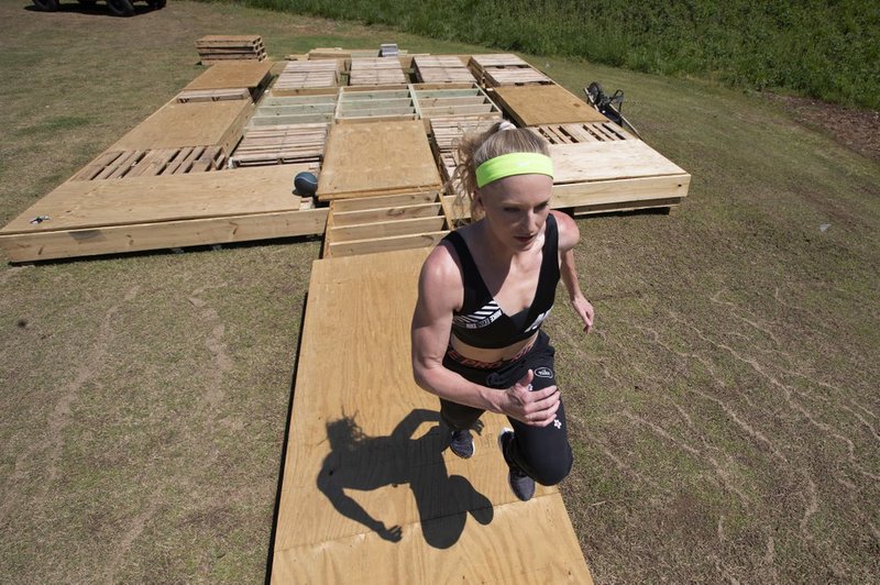 Olympic pole vaulting silver medalist Sandi Morris runs on vaulting pit she is building with her father in Greenville, S.C., Tuesday, April 14, 2020. (AP Photo/John Bazemore) story.lead_photo.caption