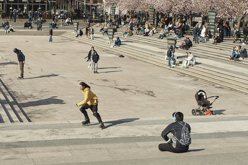 People visit a park April 4 in Stockholm, Sweden. (AP/Andres Kudacki)