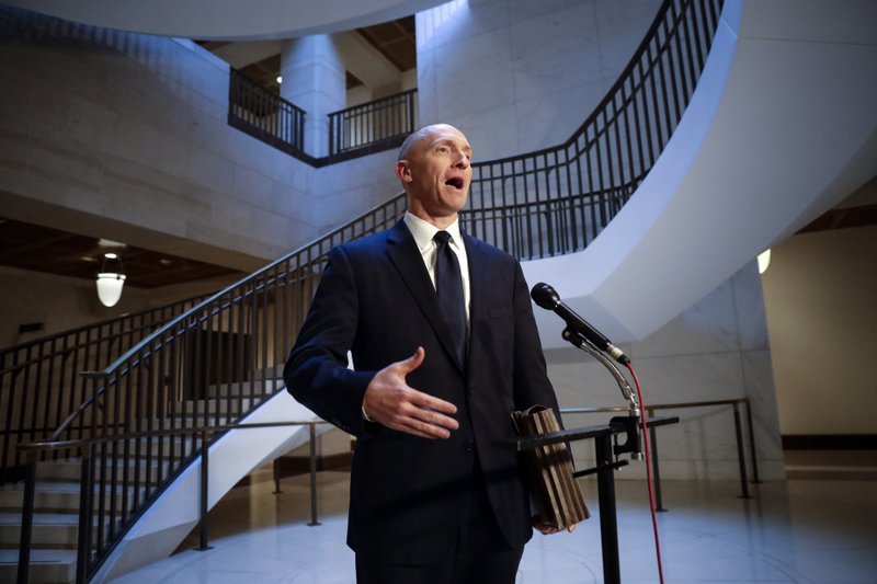 FILE - In a Nov. 2, 2017, file photo, Carter Page, a foreign policy adviser to Donald Trump's 2016 presidential campaign, speaks with reporters following a day of questions from the House Intelligence Committee, on Capitol Hill in Washington. (AP Photo/J. Scott Applewhite, File)