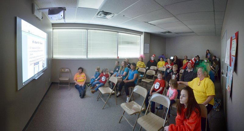 Students and family listen to recording artist Kris Allen reads ‘Go, Dog. Go!’ by P.D. Eastman from his home in Nashville over the school’s LiveLesson remote learning technology Thursday, March 3, 2017, during the Read Across America Day event at Arkansas Connections Academy in Bentonville. The tuition-free virtual public charter school serves kindergarten through 9th grade students statewide.