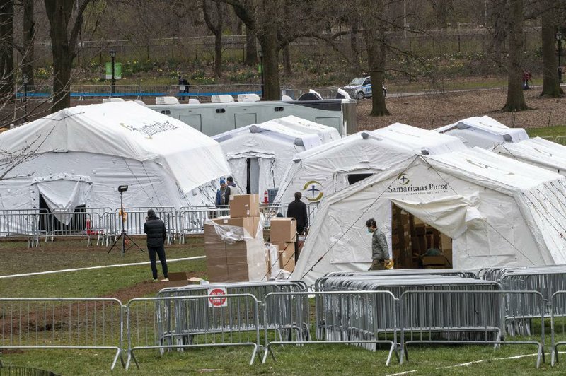 A Samaritan’s Purse crew and medical personnel work on preparing to open a 68-bed emergency field hospital specially equipped with a respiratory unit in New York’s Central Park on March 31.
(AP/Mary Altaffer)