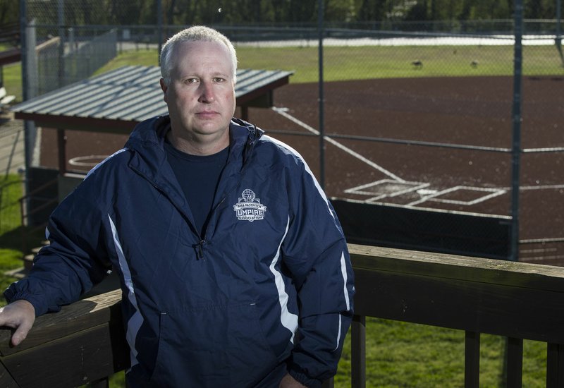 Pea Ridge’s Ray Burwell said he worked as a softball umpire 38 of 52 weekends last year. With the cancellation of high school and college softball games this spring, he said it has put a major dent in additional income. 
(NWA Democrat-Gazette/Ben Goff) 
