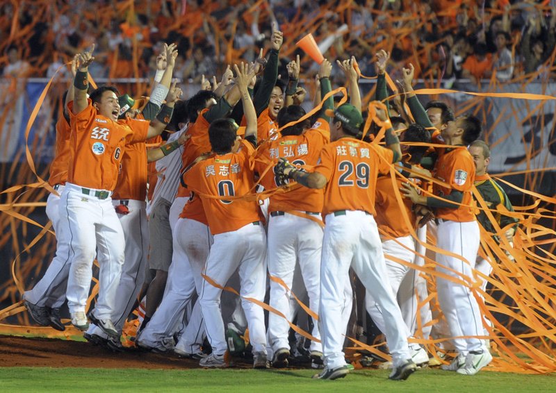 The Uni-President Lions players celebrate after winning the Chinese Professional Baseball League in Tainan, central Taiwan, in 2009.

(AP)