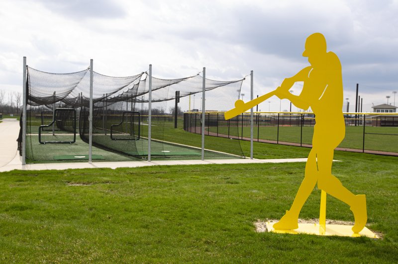 The batting cages sit unused at Grand Park in Westfield, Ind., on April 7 with the facility closed due to the coronavirus outbreak. Westfield officials estimate the area could lose $85 million in direct spending if Grand Park stays closed through June. - Photo by Michael Conroy of The Associated Press